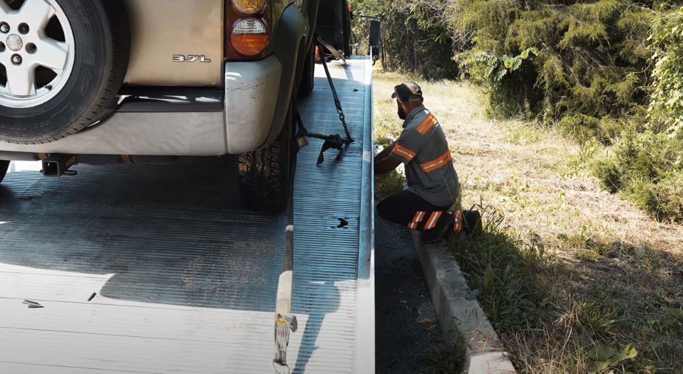 Battery replacement service being performed on a vehicle in West Babylon, NY